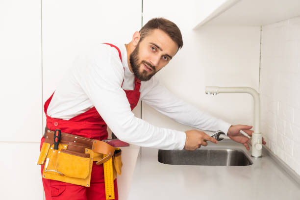 istock Side View Of A Plumber Fixing Water Tap In Kitchen 1481732344
