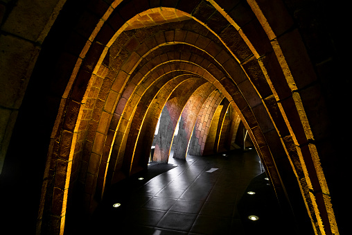 Inside an arch shaped tunnel built with bricks