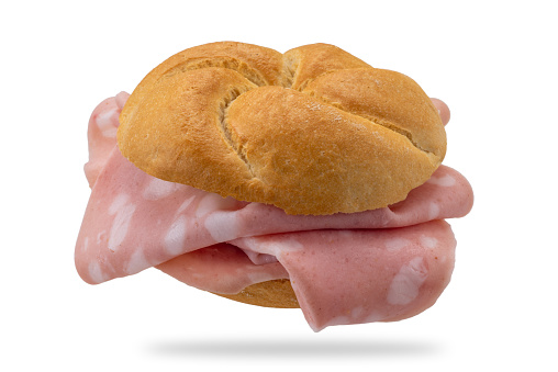 Mortadella sandwich. Typical Italian bread called rosetta stuffed with Mortadella Bologna which is a great Italian sausage. Isolated on white with clipping path