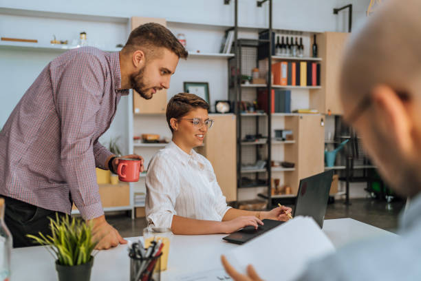 istock Colleagues working together in the office 1481737397