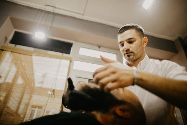 istock Man getting his beard trimmed with electric razor 1481738984
