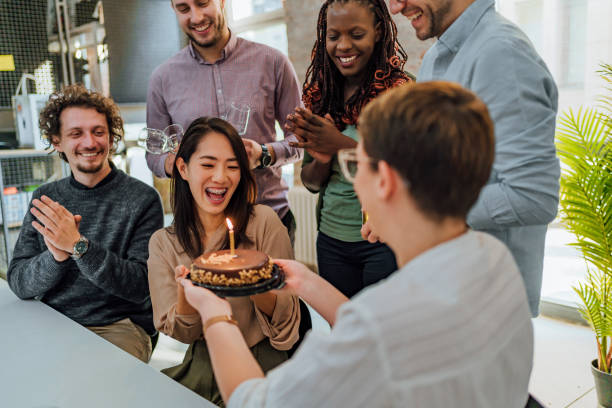 istock Colleagues celebrating a female colleague's birthday 1481739273