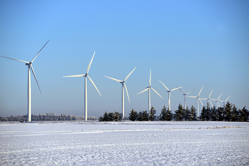wind turbines on top of the moors snow on the ground winter sunshine