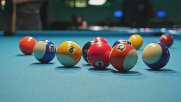 istock Eight Ball Game Pool Balls Spread on Blue Fabric Table 1481744778