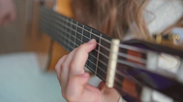 istock Young Gifted Talented Caucasian Kid Practicing Guitar Play in Music School Classroom 1481744841