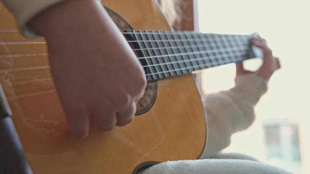 istock Young Gifted Talented Caucasian Kid Practicing Guitar Play in Music School Classroom 1481744870