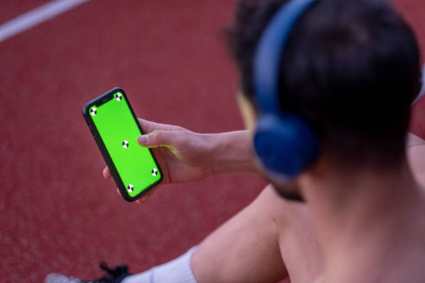 istock Half naked man looking at phone while exercising outside , mock-up screen 1481747109