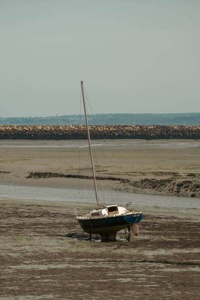 istock A Stranded Boat lies on the Beach due to the Low Tide 1481747247