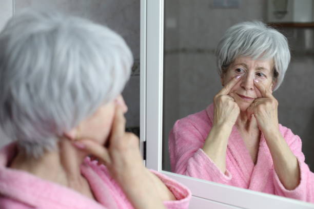 istock Senior woman pointing to her dark circles 1481748362