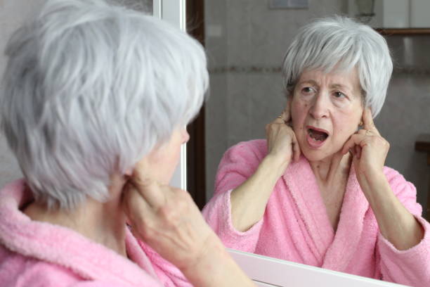 istock Senior woman hearing an unbearable noise 1481749698