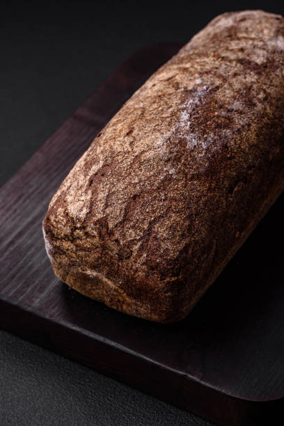istock Loaf of fresh crispy brown bread with grains and seeds 1481750146