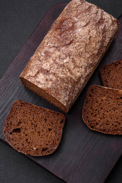 istock Loaf of fresh crispy brown bread with grains and seeds 1481750744