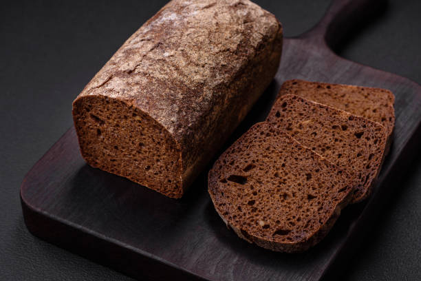 istock Loaf of fresh crispy brown bread with grains and seeds 1481750824