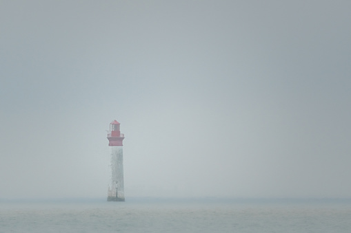 Chauveau lighthouse, isle of Re, at low tide on a foggy day