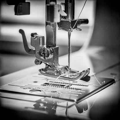 Close up view of a threaded sewing machine