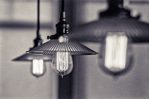 Rustic country cottage with Edison bulb light fixtures and  sunlight dappling through windows