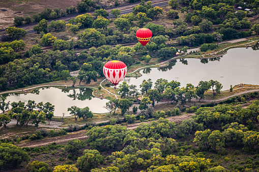 Hot Air Balloons Floating Over Water near Albuquerque, New Mexico.