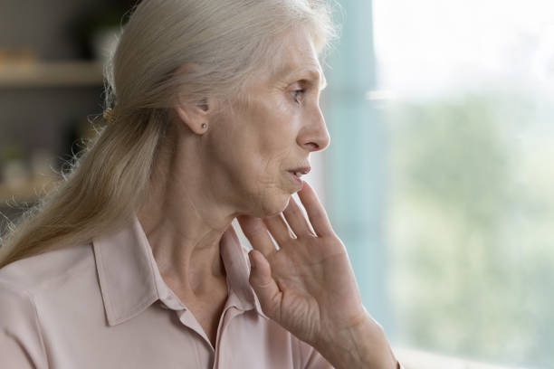 istock Frustrated concerned elderly woman looking away, touching chin 1481755921
