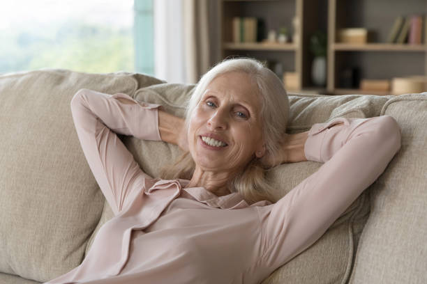 istock Cheerful elderly grey haired woman relaxing at home 1481755922