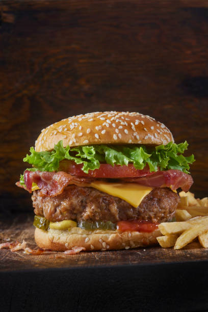istock Juicy PORK and Bacon Cheeseburger with Fries 1481757404
