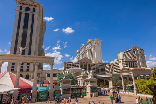 USA. Las Vegas. 09.15.2022. Beautiful view through Strip and palm trees on  Caesars Palace casino in Las Vegas,