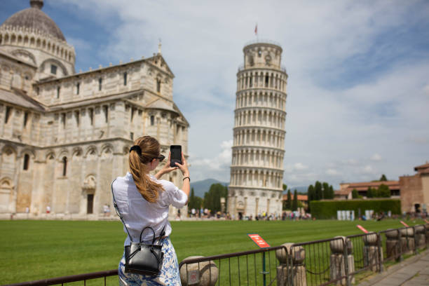 Taking pictures of the Leaning Tower Taking pictures of the Leaning Tower pisa leaning tower of pisa tower famous place stock pictures, royalty-free photos & images