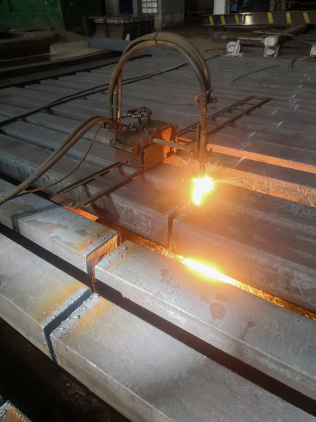 istock Metallurgical plant - metal processing. The workpiece is processed by a gas-cutting machine. Cutting a square before processing and sorting. Steel production at the plant. 1481759925