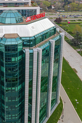 Belgrade, Serbia - April 09, 2023: Assicurazioni Generali Insurance Building Modern Office Tower With Green Windows.