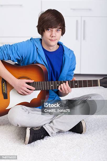 Young Teenager Boy Playing The Guitar Stock Photo - Download Image Now - Acoustic Guitar, Adolescence, Adult