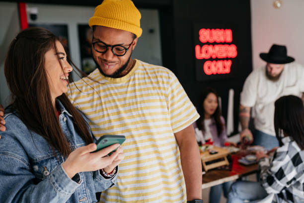istock Friends talking and eating sushi 1481764920