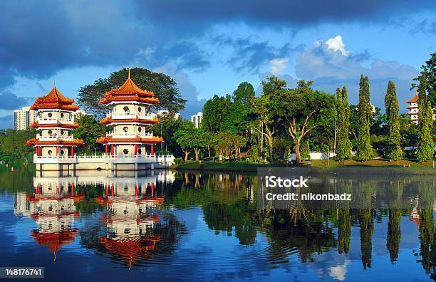 Pagodas Beside A Lake Stock Photo - Download Image Now - Singapore, Singapore City, Formal Garden