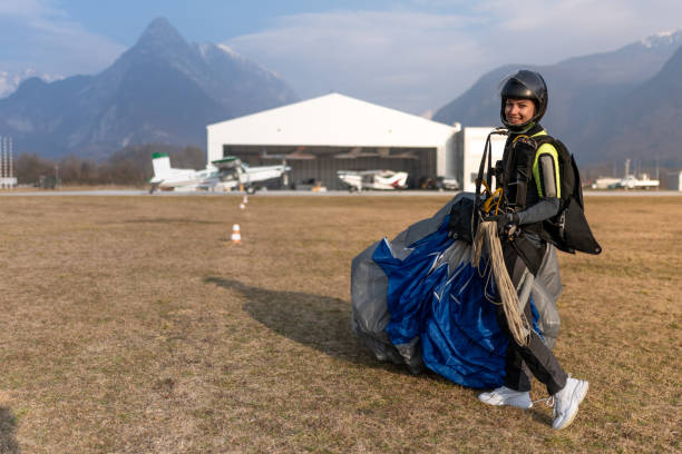 istock Skydiving woman touches the ground. 1481768252