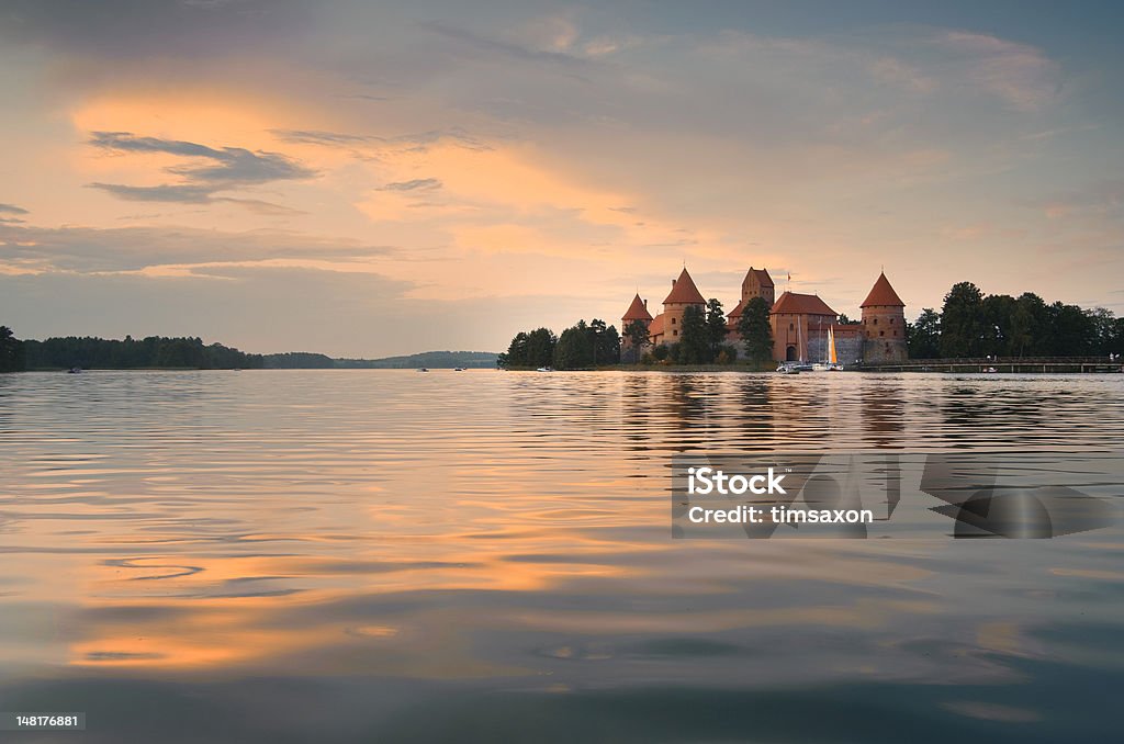 Trakai Sunset Dusk at the island castle of Trakai, one of the most popular tourist destinations in Lithuania. The castle was the medieval capital of Lithuania and houses a museum and a cultural center. Lithuania Stock Photo