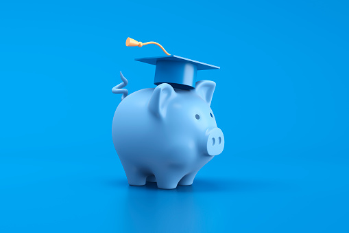 Piggy bank and graduation cap on blue background. 3d illustration