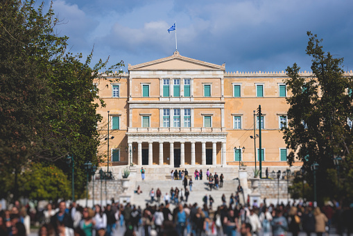 Greek Parliament in Old Royal Palace building facade exterior, Hellenic Bouleterion parliament house on Syntagma square, Athens, Attica, Greece in a summer sunny day