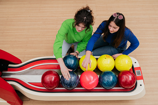 Friends With Multicolored Bowling Balls