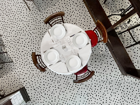 Looking down on a restaurant table with empty plates