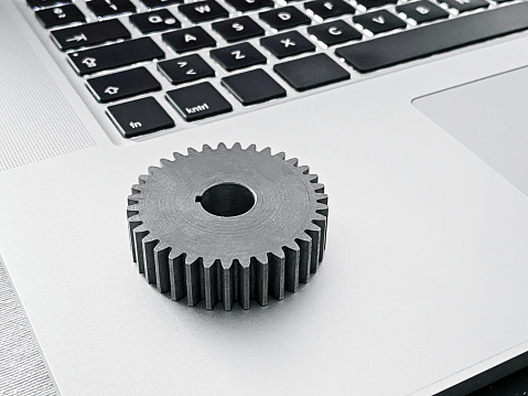 Cogwheel on top of a Laptop