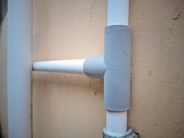istock residential water pipes with orange wall background 1481785549