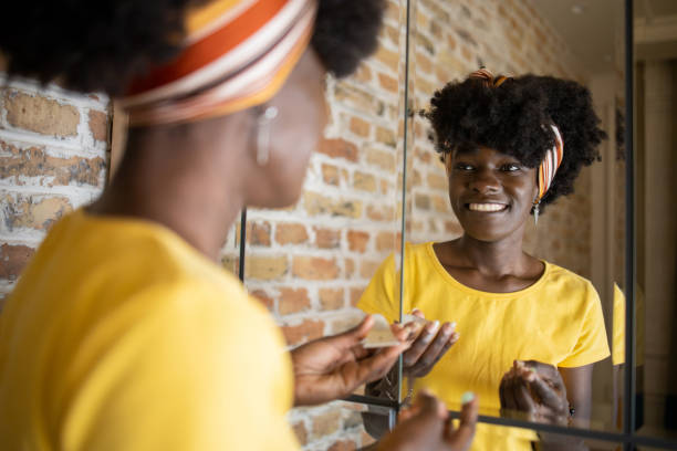 istock Handsome woman applying moisturizer to his face 1481787761