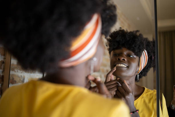 istock Handsome woman applying moisturizer to his face 1481787764