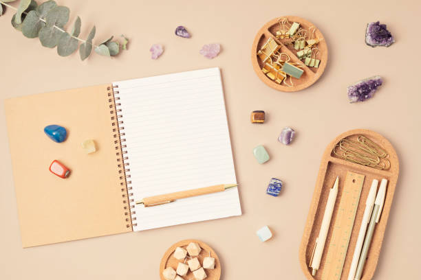 istock Healing chakra crystals and open organizer. Rituals with gemstones for career, wellness, concentration, business, destress, relaxation, mental health, spiritual practices. Energetical power concept 1481789029
