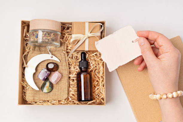 istock Gift box for improving sleep quality with gemstones. Healing chakra crystals, candle, essential oil and sleeping mask. Care package for natural treatment of insomnia 1481789043