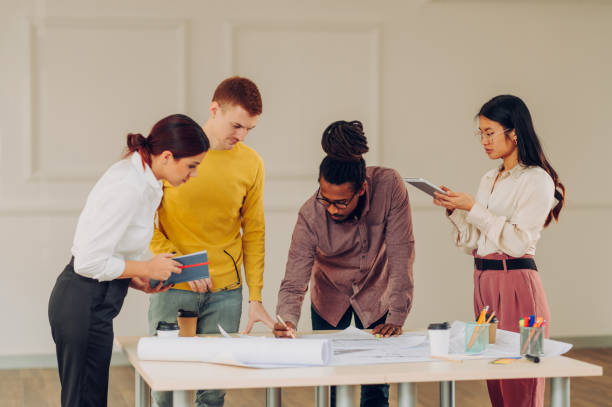 istock Diverse group of engineers or architects having a meeting in an office 1481789561