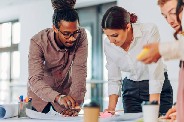 istock Diverse group of engineers or architects having a meeting in an office 1481789565
