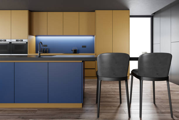 istock Golden yellow and blue Modern minimalist kitchen with long island with stools. Matte materials. 1481789958