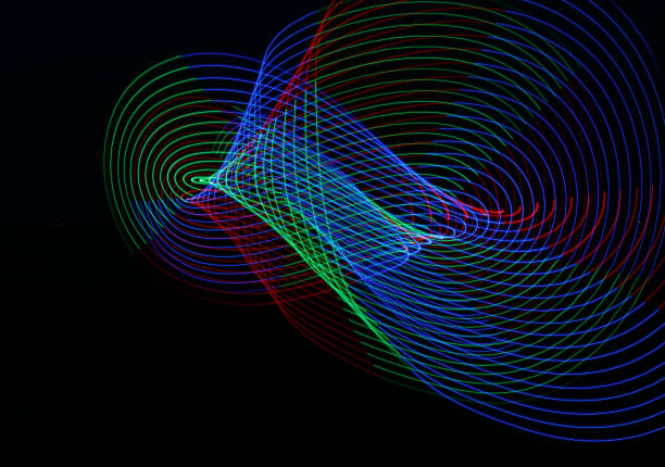 istock Vibrant swirling light trails on a black background 1481792318