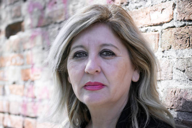 istock Pensive thoughtful middle aged woman looking away. 1481792322