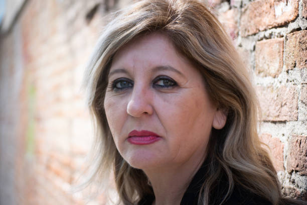 istock Pensive thoughtful middle aged woman looking away. 1481792425