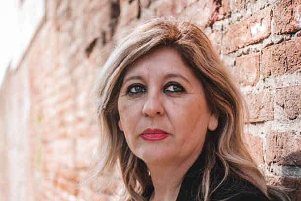 istock Pensive thoughtful middle aged woman looking away. 1481792585